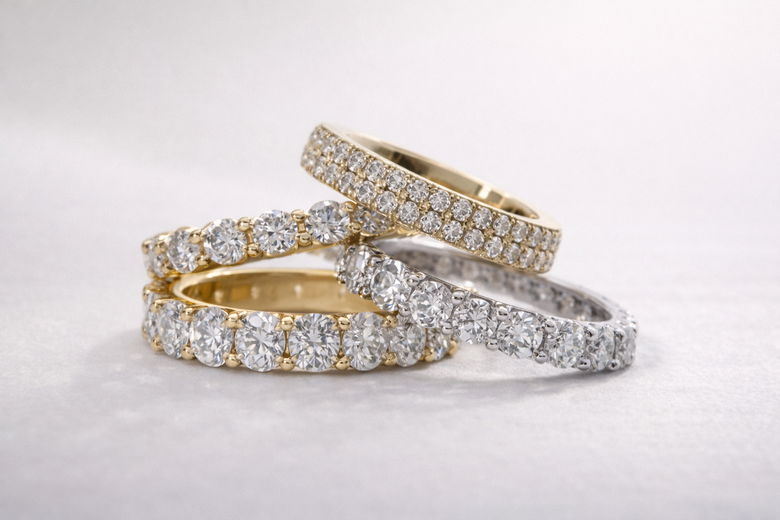 Full vs Half Eternity Band Cross-Sections - Detailed side-view comparison showing stone placement, comfort zones, and sizing flexibility differences between full and half eternity designs